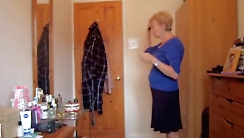 Wearing a blue skirt and flashing her tits